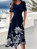 Blaues, kurzärmeliges Midikleid mit V-Ausschnitt und Blumenmuster