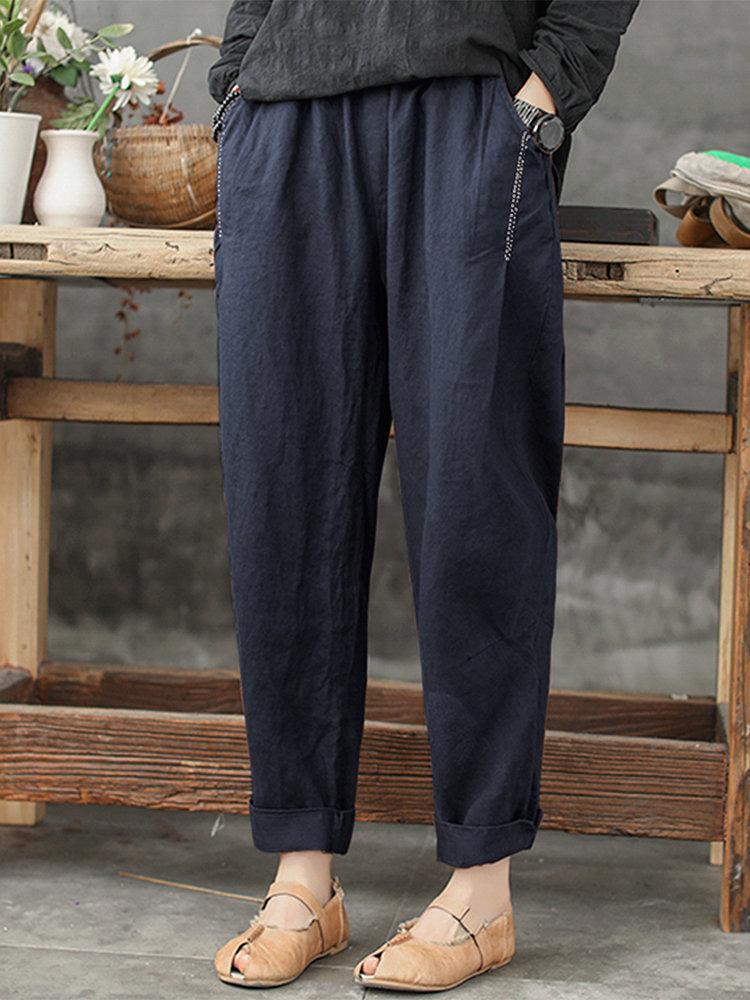 Pantalon harem ample grande taille couleur unie avec poches