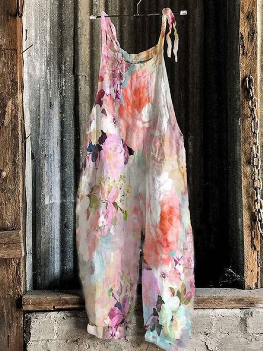 Rosa, lässiger, ärmelloser Jumpsuit mit Blumenmuster.