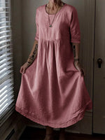 Robe élégante ample à col rond et couleur unie