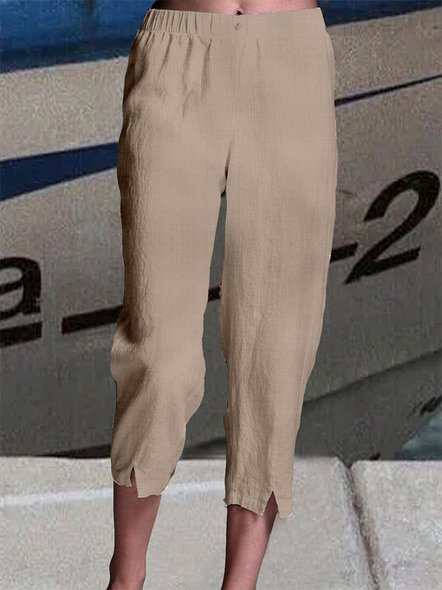 Pantalon capri uni en lin, coupe ample et taille élastique, idéal pour l'été.