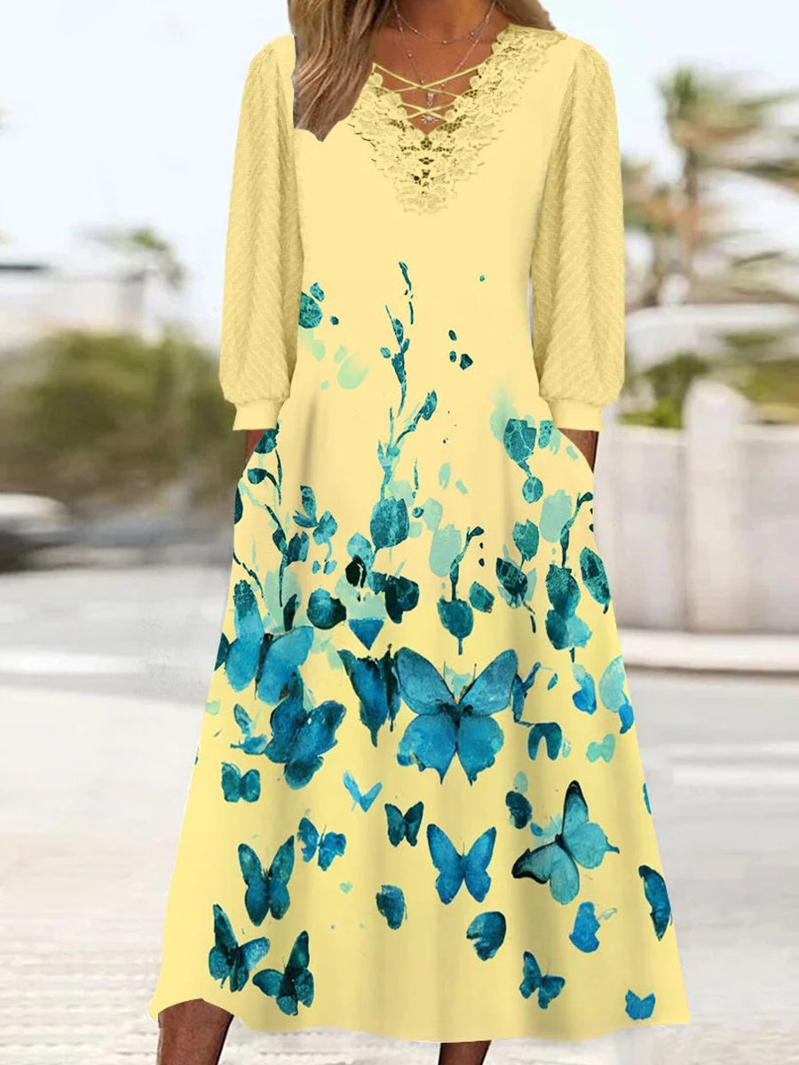 Robe midi à manches longues et col en V pour femme, ornée de dentelle et d'un imprimé graphique.