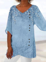 Blaue, lässige Bluse mit V-Ausschnitt, Blumenmuster und halben Ärmeln, bedruckt mit Blumenmuster und V-Ausschnitt