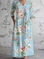Robe longue bleue à imprimé floral, col en V et manches 3/4
