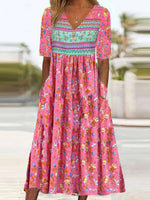 Robe longue ample à col en V et manches courtes à imprimé floral, idéale pour les vacances