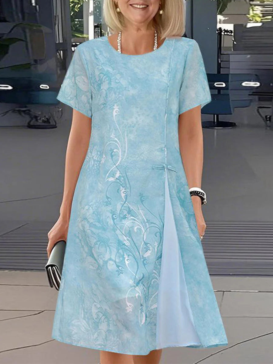 Superbe mini-robe à col rond et manches courtes