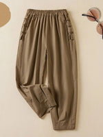 Pantalon harem à taille élastique unie pour femme, avec boutons et pointes en V.