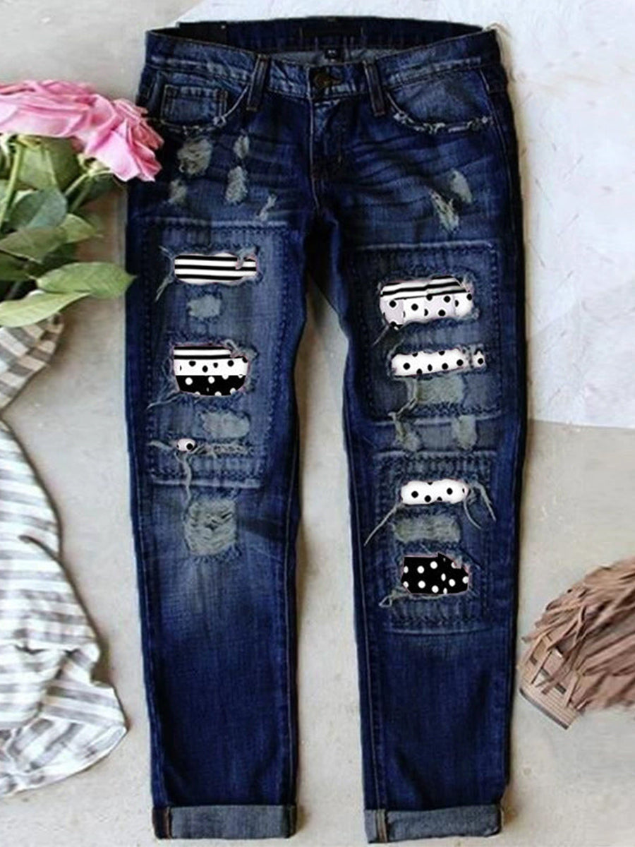 Jean stretch déchiré à ourlet brut effiloché et usé