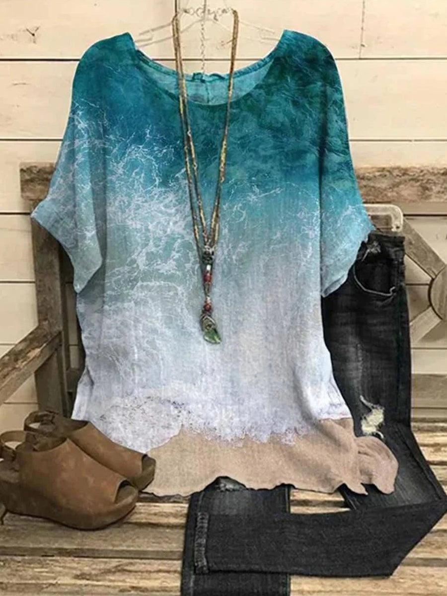 Kurzarmbluse mit Strand-Grafikprint und Rundhalsausschnitt