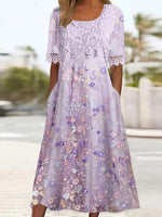 Robe midi violette à manches courtes et poches latérales