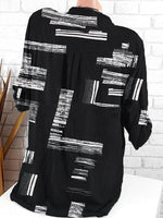 Schwarzes Freizeithemd mit Kragen und geometrischem Muster