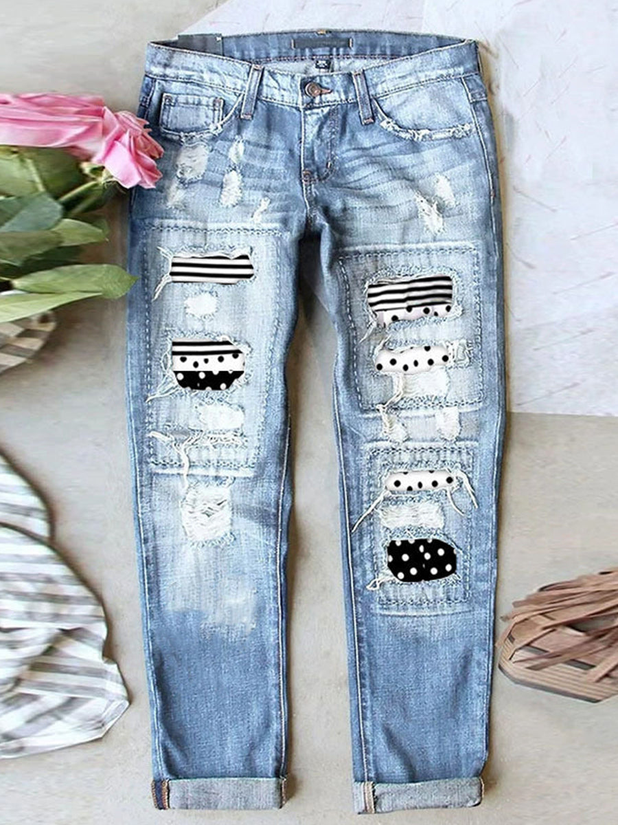 Jean stretch déchiré à ourlet brut effiloché et usé