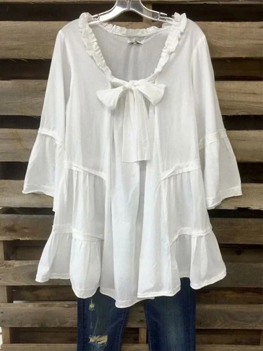 Chemisier blanc chic à manches 3/4 et nœud papillon ample