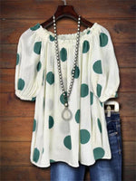 Haut à pois à manches bouffantes