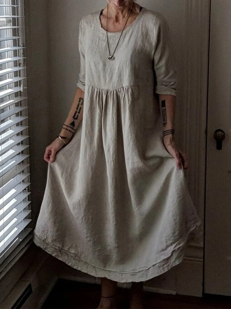 Robe élégante ample à col rond et couleur unie