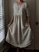 Robe élégante ample à col rond et couleur unie