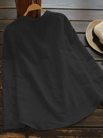 Chemisier à manches longues, col montant et poches unies