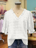 Haut texturé à manches bouffantes