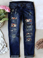 Jean stretch déchiré à ourlet brut effiloché et usé