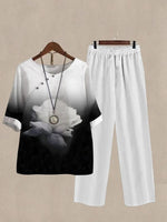 Schwarzer, lässiger zweiteiliger Anzug mit Rundhalsausschnitt, Rosenprint und halben Ärmeln