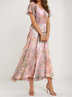 Robe longue rose à col V et imprimé floral
