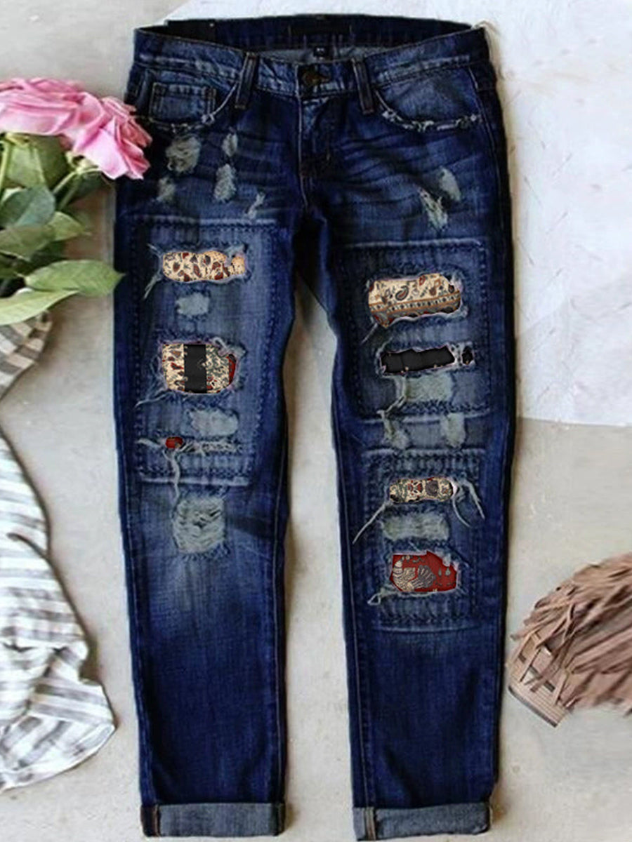 Jean stretch déchiré à ourlet brut effiloché et usé