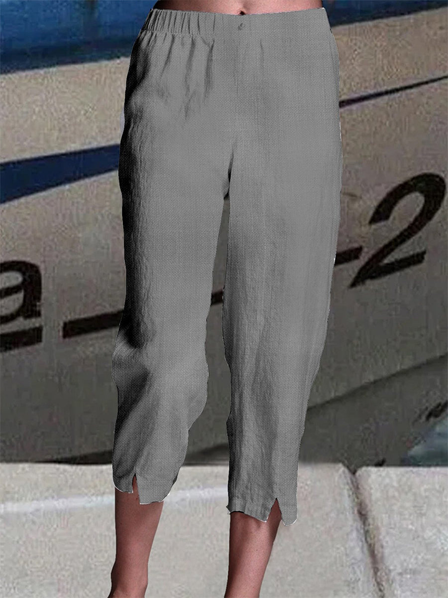 Pantalon capri uni en lin, coupe ample et taille élastique, idéal pour l'été.