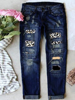 Jean stretch déchiré à ourlet brut effiloché et usé